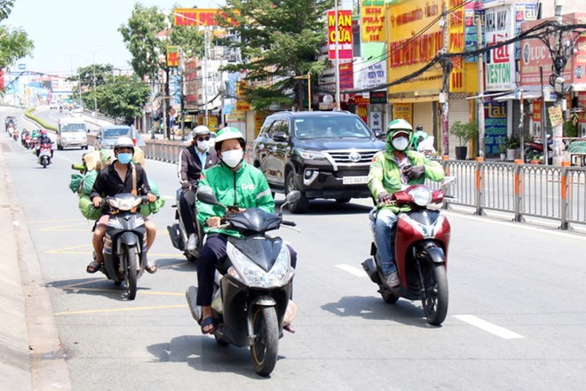 TP Hồ Chí Minh quản lý chặt hoạt động của shipper trong mùa dịch | Giao  thông | Vietnam+ (VietnamPlus)